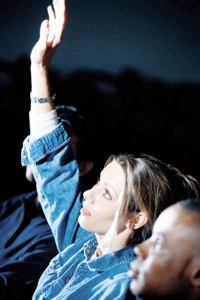 photo of student raising her hand