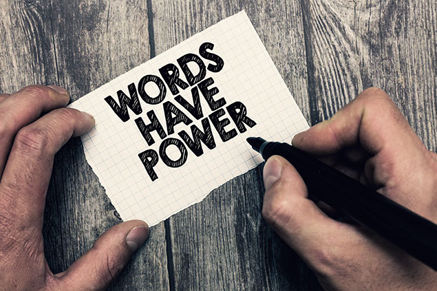 Image of hand writing showing Words Have Power.