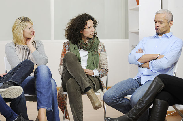 Image of 3 people learning to communicate to reduce stress.