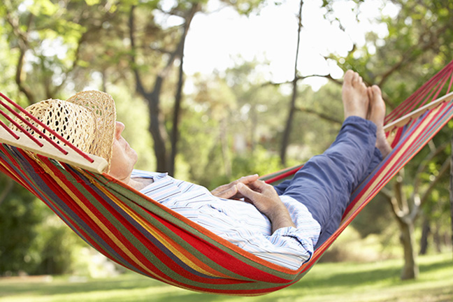 Image of person in a relaxing in a hammock.