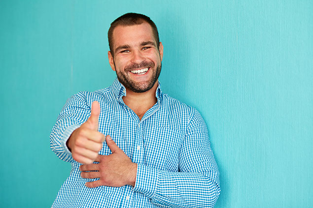 Image of a man with thumbs up.