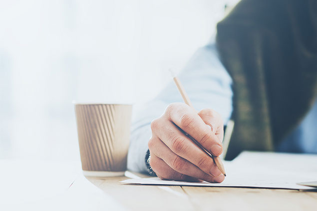 Image of person writing.