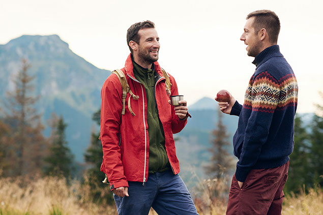 Image of 2 friends talking in the great outdoors.