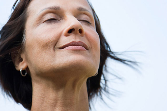 Image of women deep breathing.