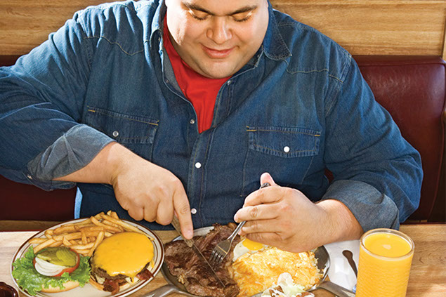 Image of man over-eating.