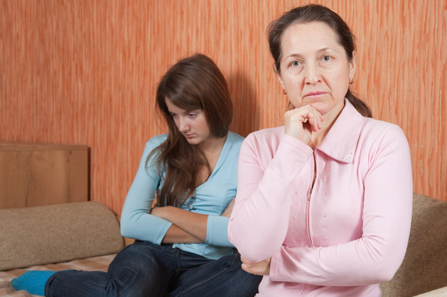 Image of mom being assertive with teenage daughter.