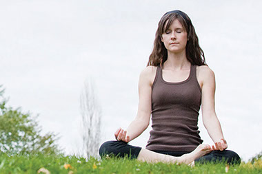 Image of women meditating.