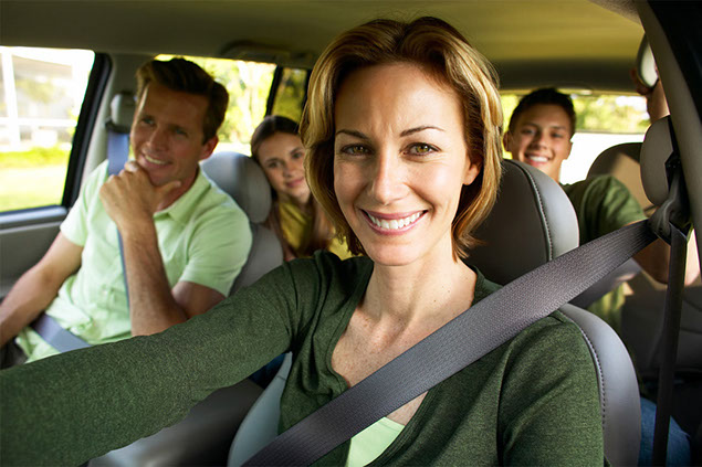 Image of family driving in car.