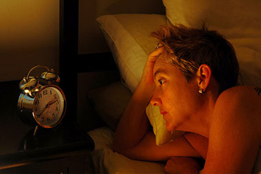 Image of woman in bed awake at 2:40am.