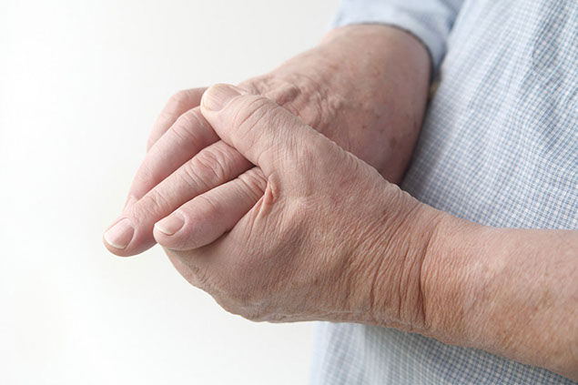 Image of person holding hand.