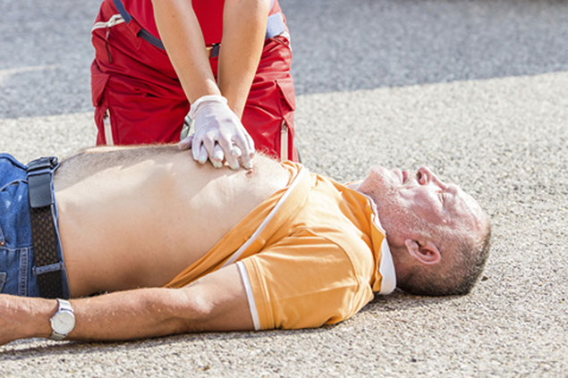 Image of man receiving CPR.