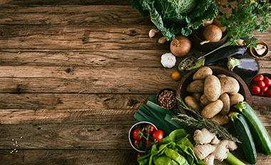 Image of fresh foods and herbs, such as potatos, tomatoes, onions, etc.