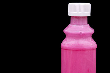 Image of medicine in pink bottle.