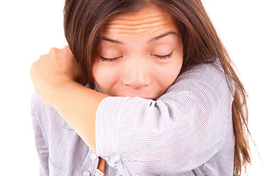 Image of women sneezing.