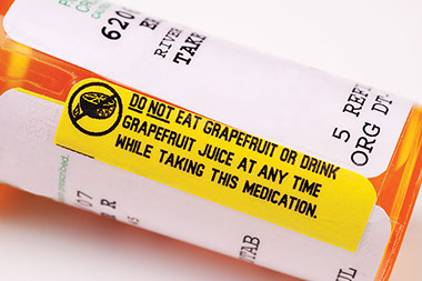 Image of pill bottle with warning about grapefruit.
