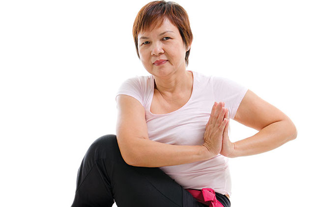 Image of women in yoga position.