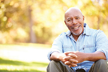 Image of older male smiling.