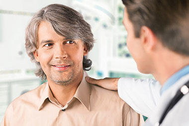 Image of man talking to his doctor.
