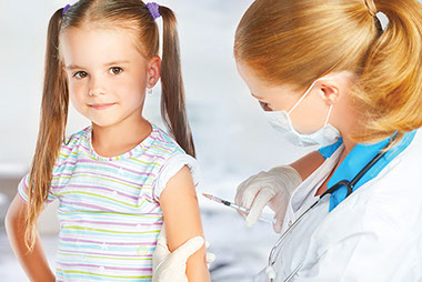Image of child receiving a shot by a doctor.