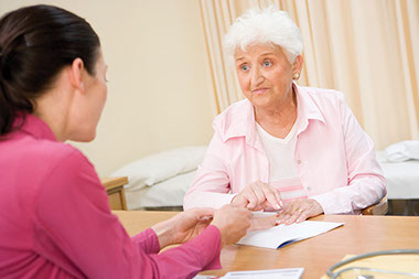 Image of doctor talking to patient.