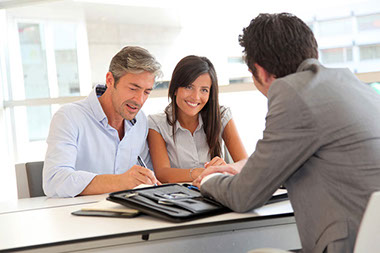Image of couple talking to a health care agent.