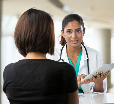 Image of doctor talking to patient.