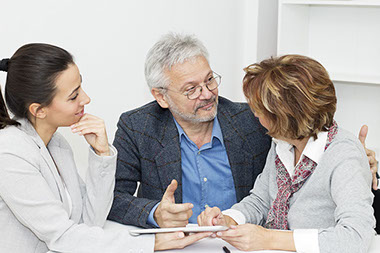 Image of couple talking to an insurance agent.