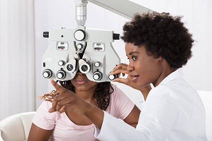 Image of eye doctor with patient.