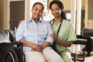 Image of nurse with wheelchair bound women.