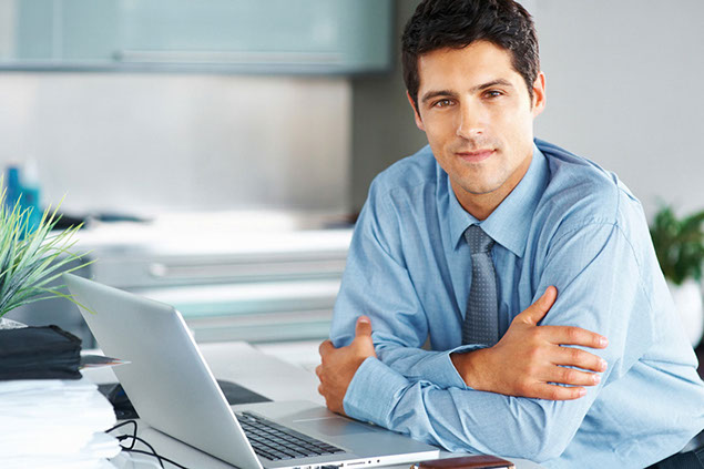 Image of business man sitting at desk.