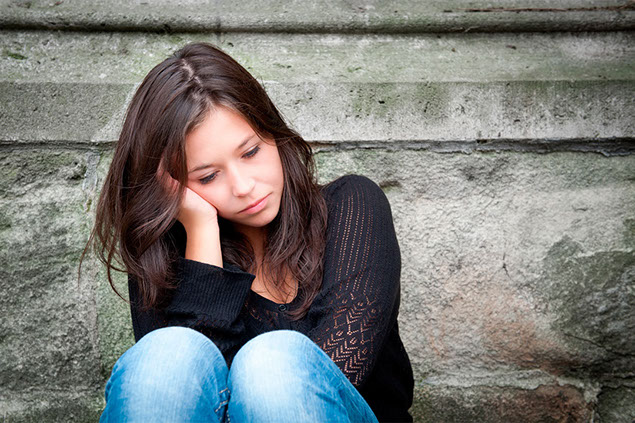 Image of women sitting alone.