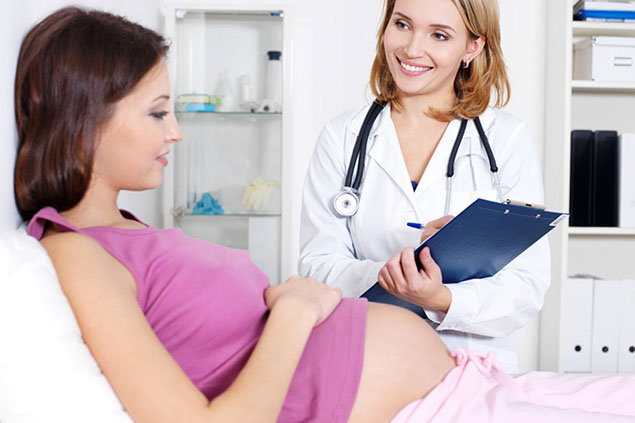 Image of pregnant women at doctor's office.