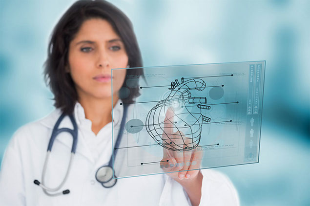 Image of doctor pointing to a smart board with a heart illustration.