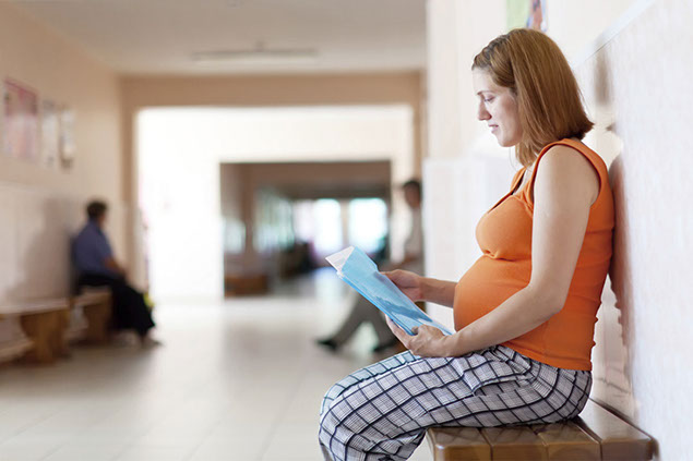 Image of pregnant women sitting on bench.