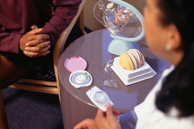 Image of doctor and patient going over birth control options.