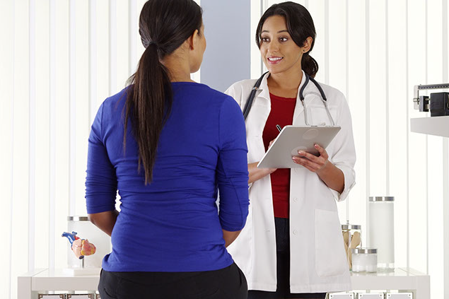 Image of female doctor with female patient.