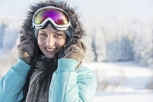 Image of women outside during winter with winter clothing on.