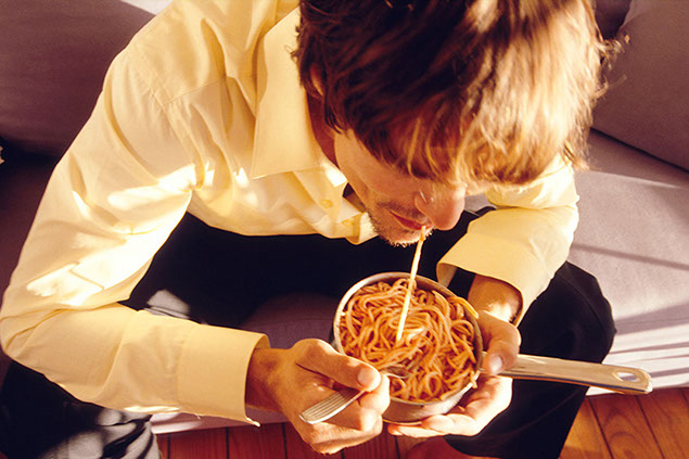 Image of stressed young adult eating.