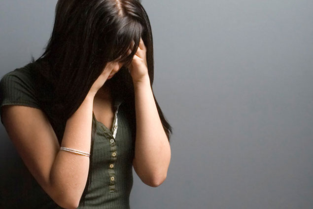 Image of women with a headache.