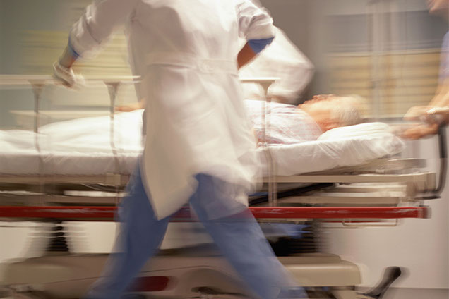 Image of patient rushing into the ER.