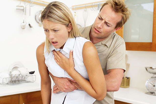 Image of giving a person first aid for choking.