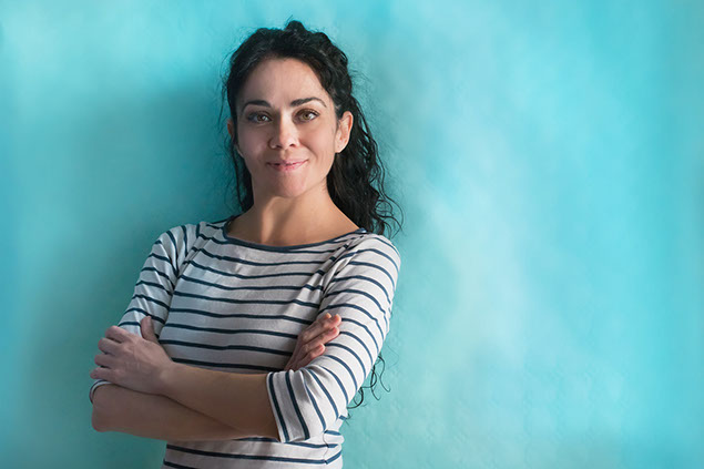 Women with arms crossed looking convinced and confident.