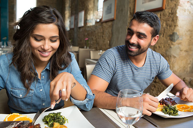 Couple having dinner at restaurant.
