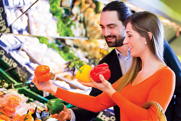 Couple grocery shopping.