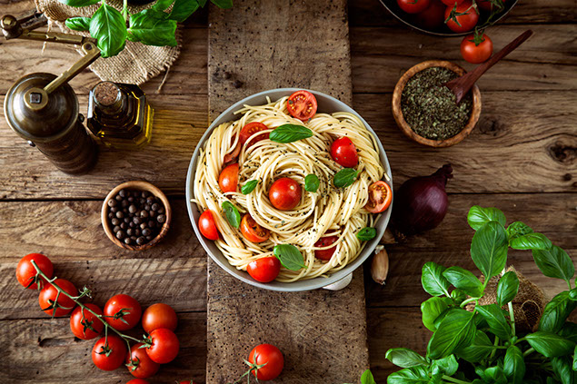 Pasta with olive oil, garlic, basil and tomatoes.