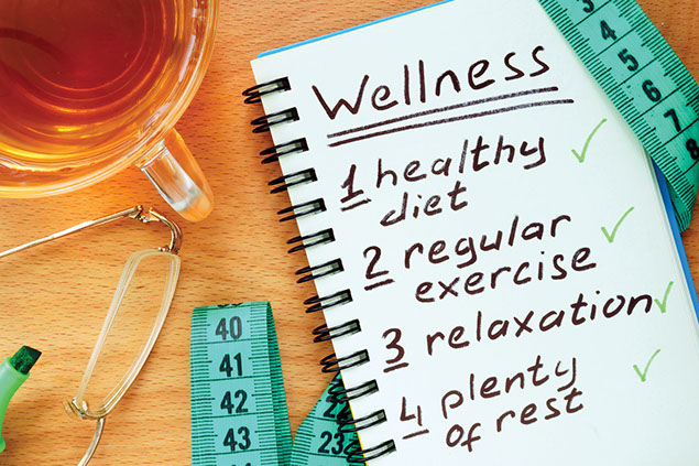 Notebook with wellness checklist, including diet, fitness and rest.