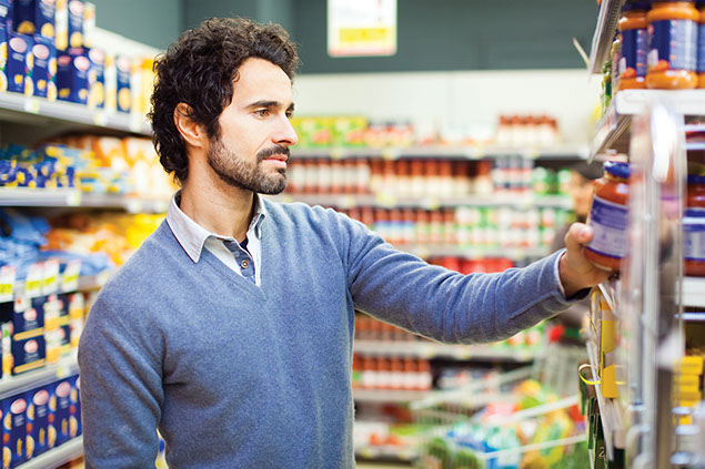Man grocery shopping.