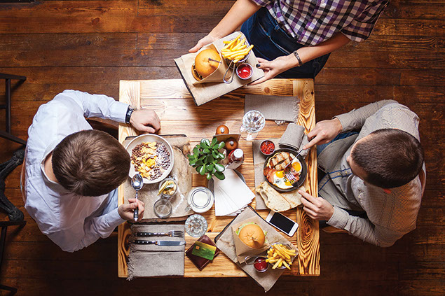 Two people eating at a restaurant.