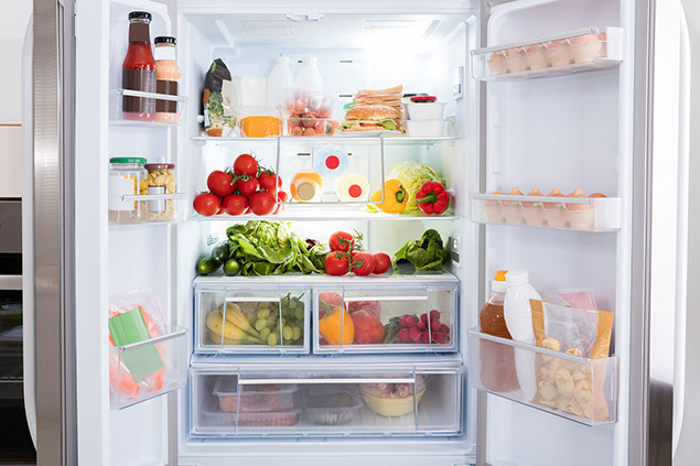 Refrigerator filled with fresh fruits and vegetables.