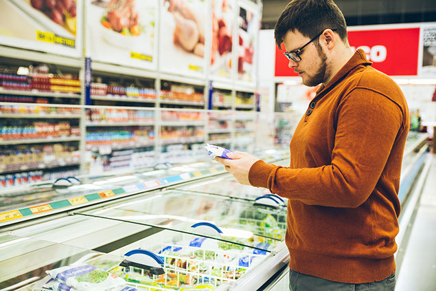 Man reading food label.